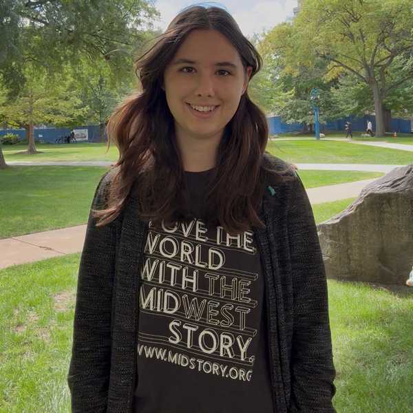CWRU student posing for a photo on Case Quad.